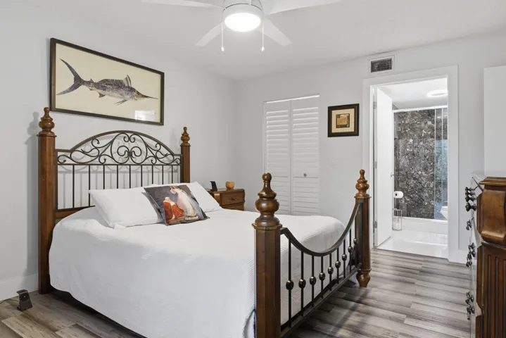 Primary bedroom with view of bathroom and walk in closet