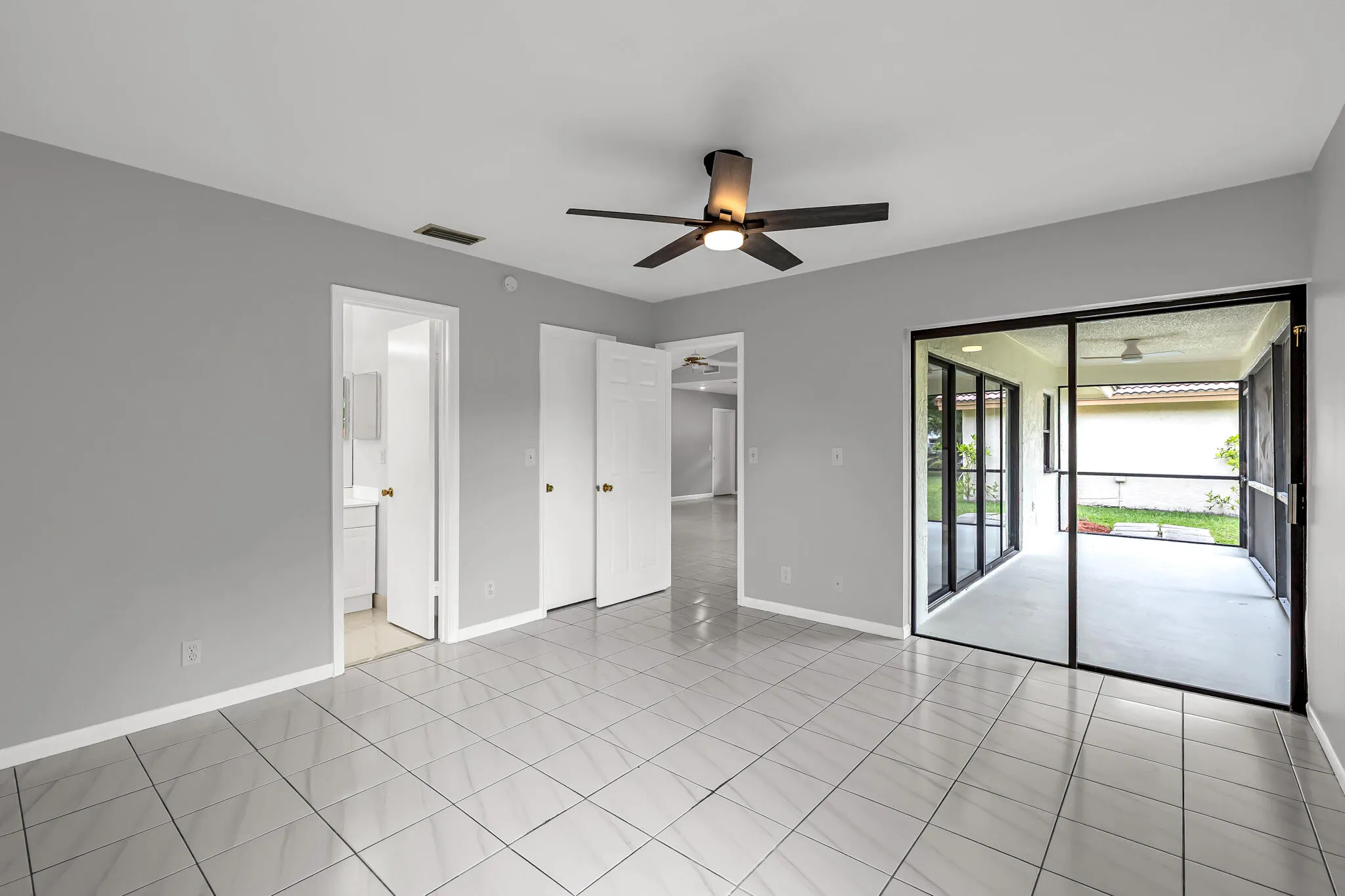 PRIMARY BEDROOM- Access to patio. Walk in closet.