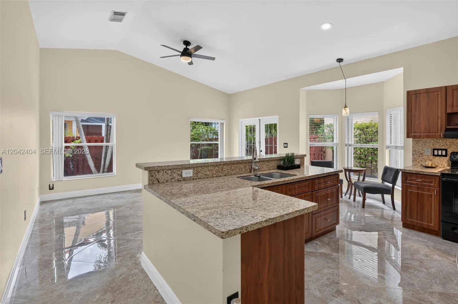 Open family room adjoining kitchen area.