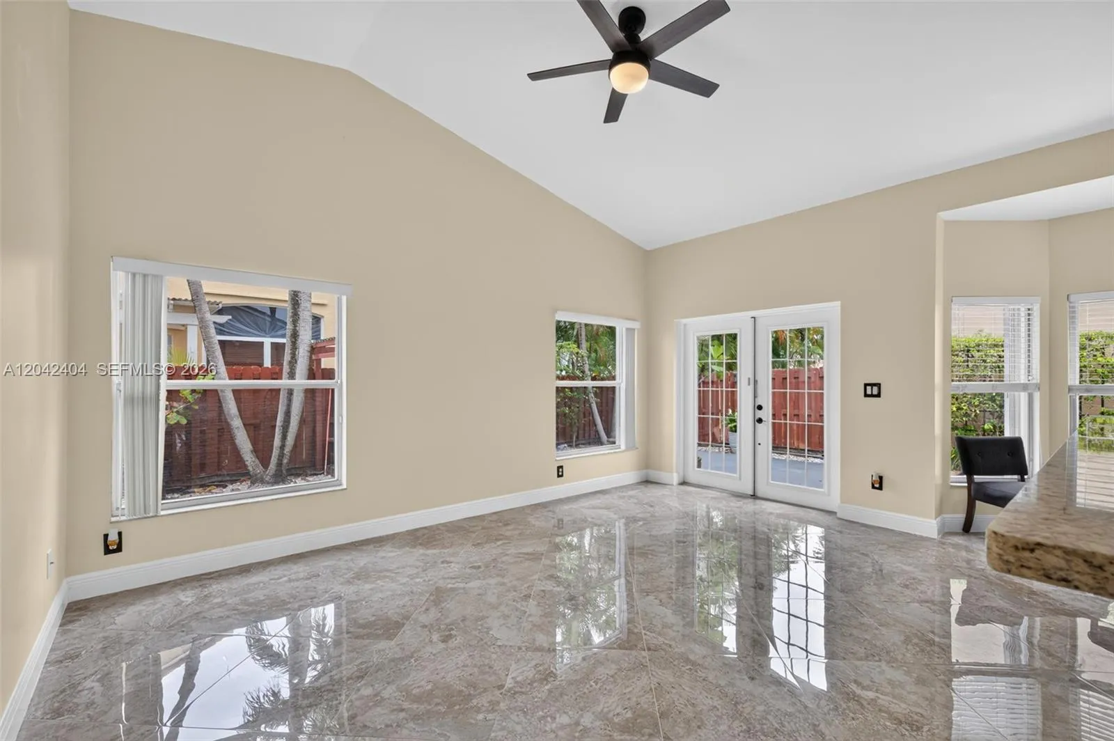 Open family room has fabulous volume ceilings.