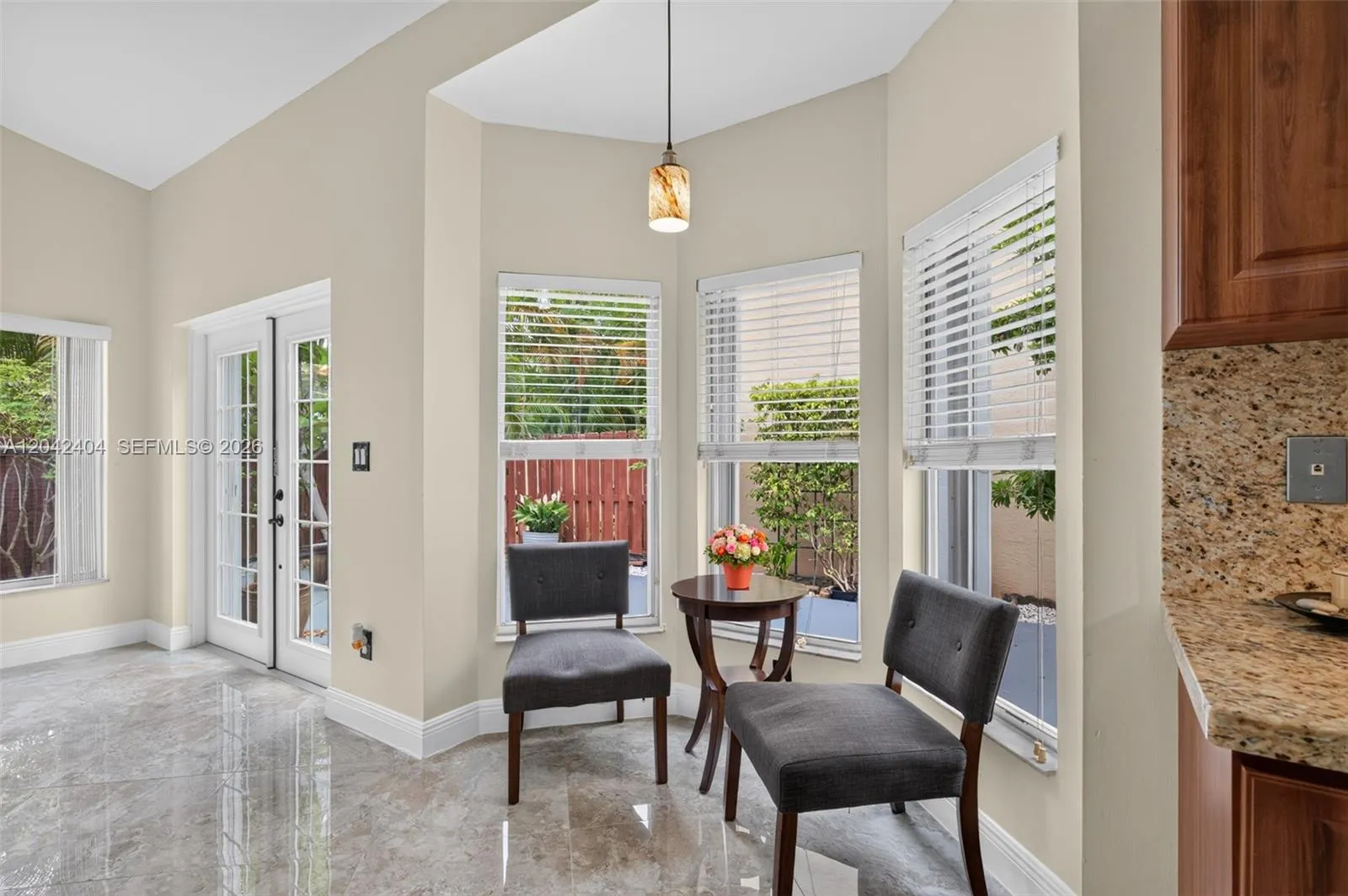 French doors lead to tranquil patio area.