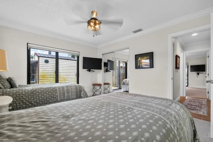 second bedroom ceiling fan with slider door and ceiling fan