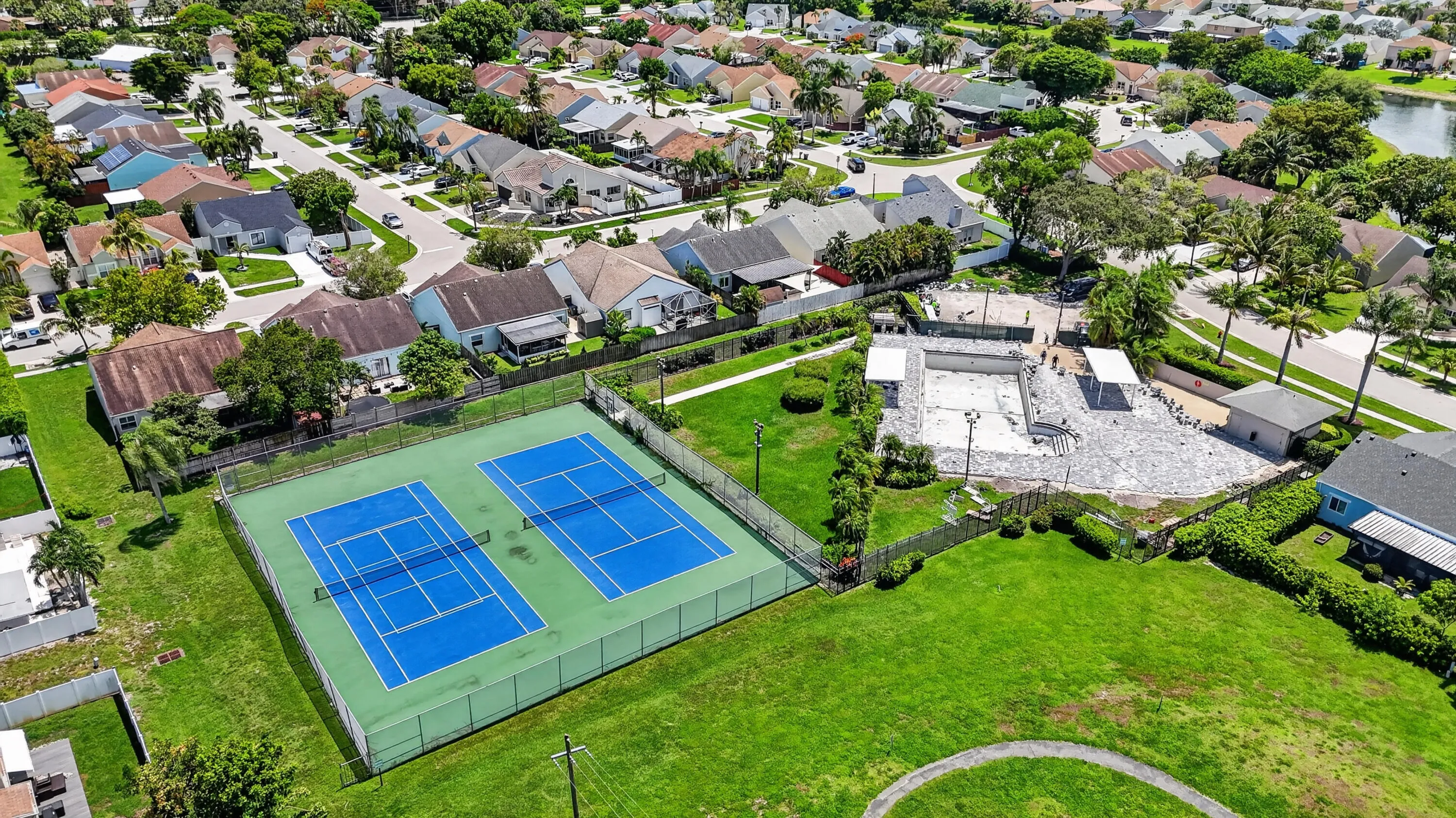 view of tennis courts and pool is currently under rennovation