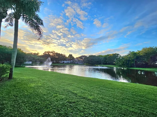ONE OF THE 5 PONDS IN THE BACK OF YOUR BUILDING WITH A PICNIC TABLE AND GRILL FOR YOU ENJOY.