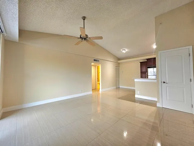 ANOTHER VIEW OF THE LIVING AREA SPACE SHOWING ANOTHER STORAGE CLOSET TO THE RIGHT OF THE PICTURE.