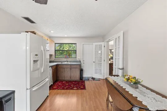 French doors to main living area and separate door leading to pool area