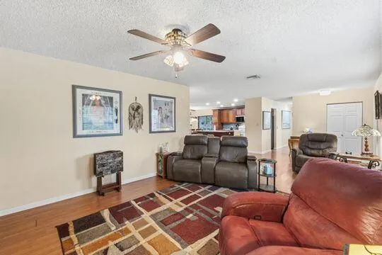 Spacious living room with lots of windows