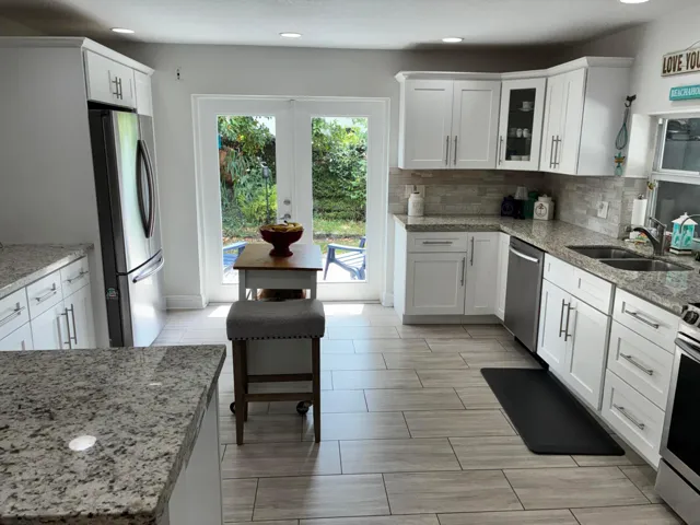 Kitchen opens up to Beautifull side patio