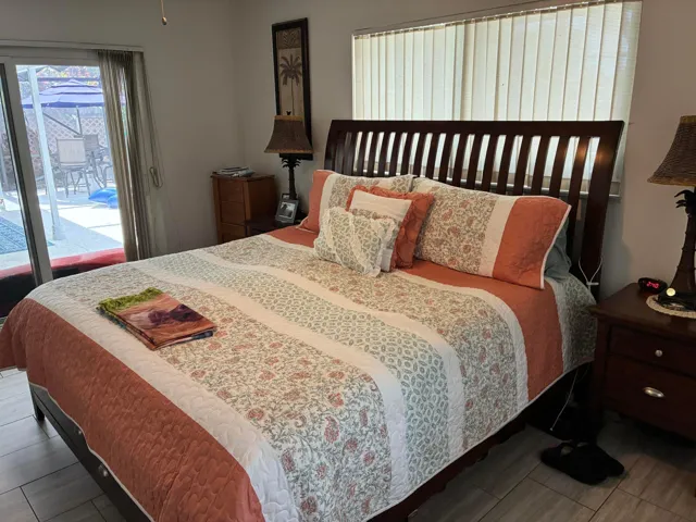 The master bedroom surrounded by windows, so very brigh.