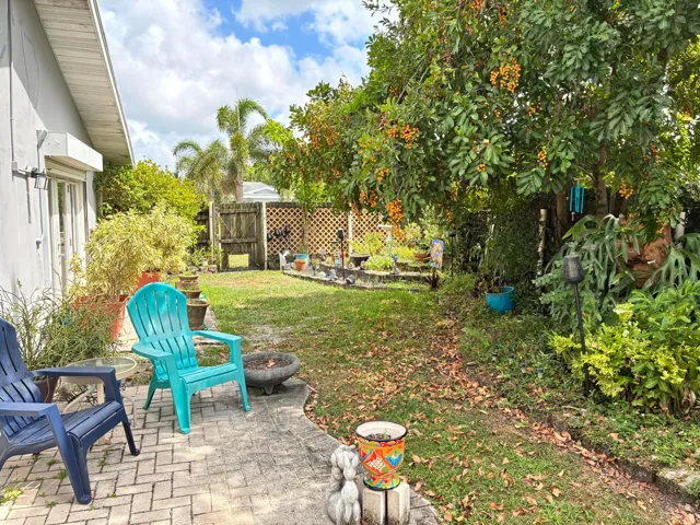 Side patio of living room, with a small paver deck for your relaxation, or meditation