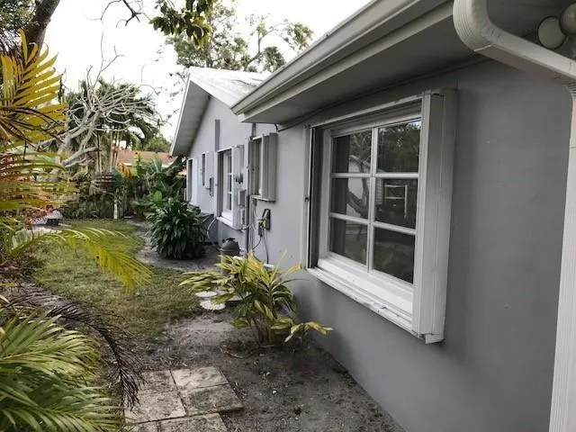 Side patio behind the bedroom, with 2 storage sheds
