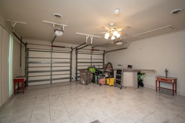 2 Car Garage with A/C, all tile floor. This can be used as a den/play are/game room.