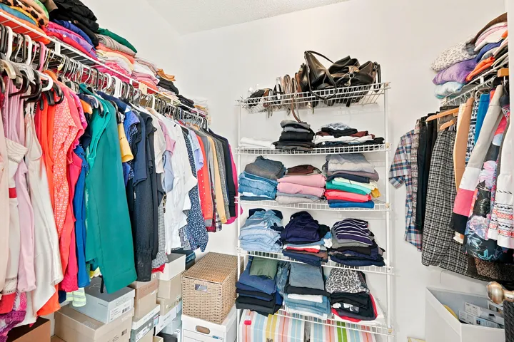 Walk in closet in the primary bedroom