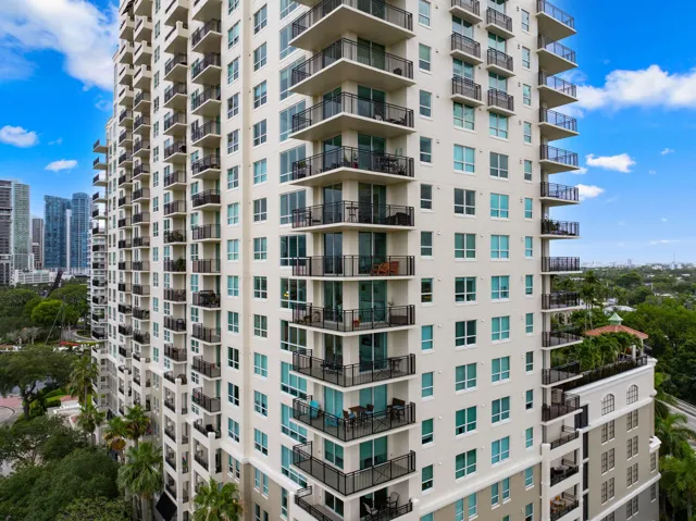 Exterior view of The Symphony’s North Tower, a riverfront residence with expansive balconies along the New River.