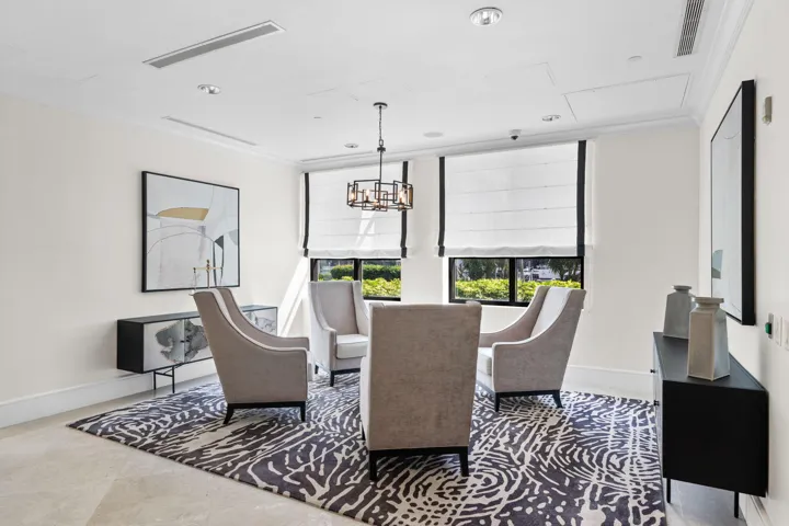 Comfortable business lounge offering seating, natural light, and an inviting space to work or meet informally.