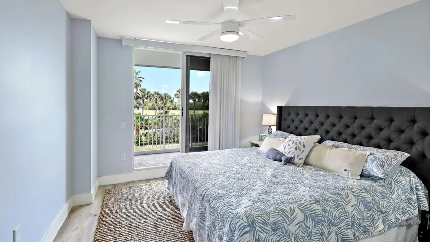 This secondary bedroom is currently being utilized as the primary bedroom, while the designated primary bedroom is being used as a home office.