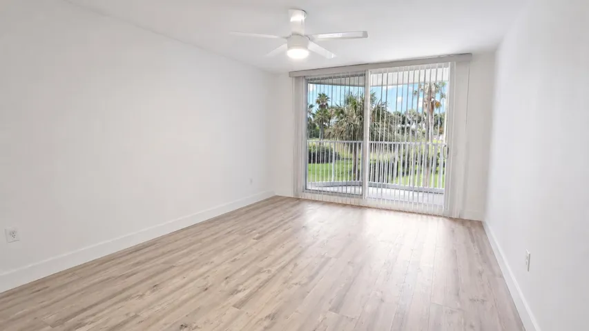 Digitally edited image showcasing the spacious primary bedroom with furniture removed.
