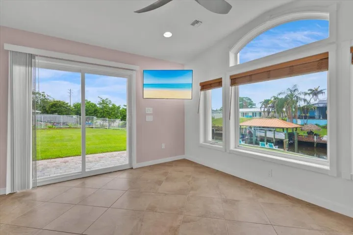 Master bedroom - slider to back yard and view of dock