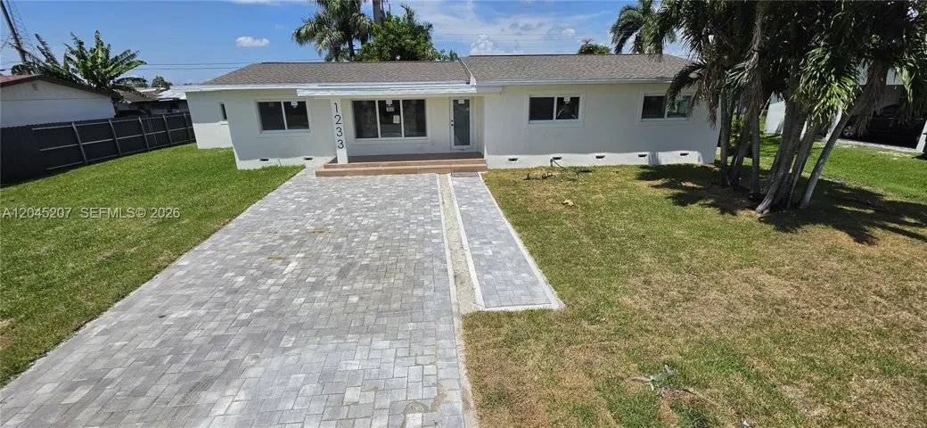 Beautiful facade, new paver driveway and new roof!