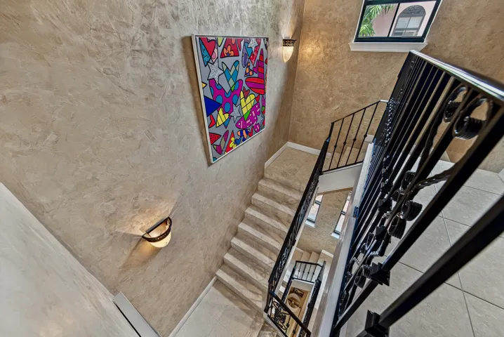 Lovely staircase with iron railings.