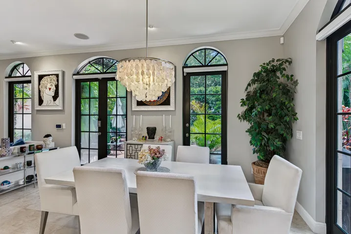Lovely Dining with views of the lush landscaped pool & private courtyard.