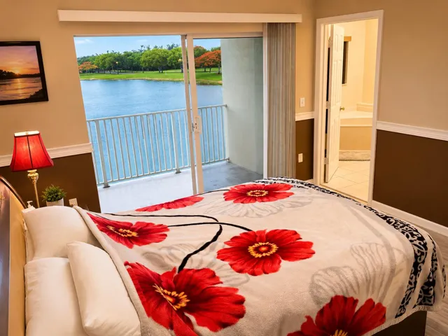 Master bedroom with a lake view