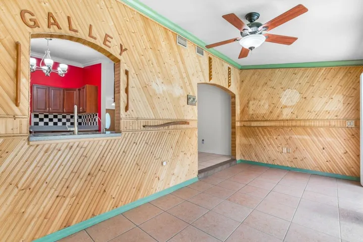 Florida room with Galley Opening to Kitchen Sink