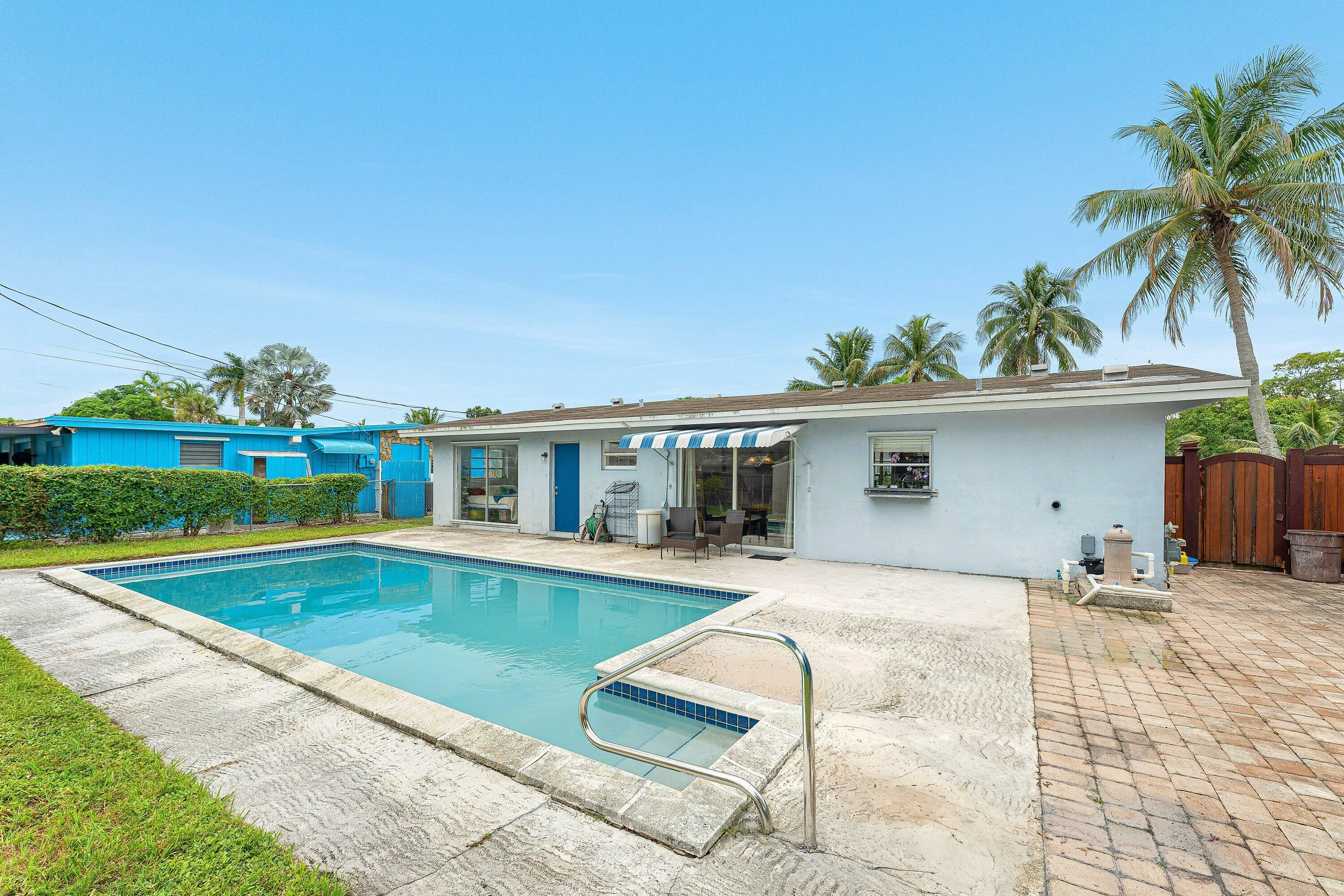 Double sliding doors lead out to the pool area