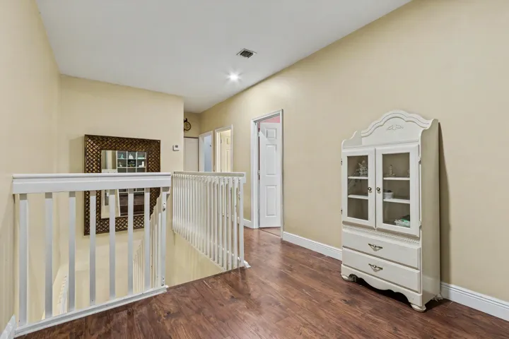staircase leading to 5 bedrooms upstairs