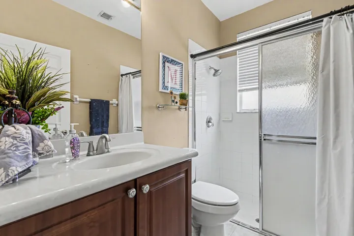 full bathroom downstairs with large walk-in shower