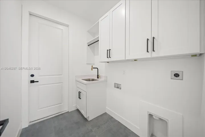The expansive closet offers built-in shelving, drawer storage, and abundant hanging space, creating a clean and functional luxury wardrobe experience.