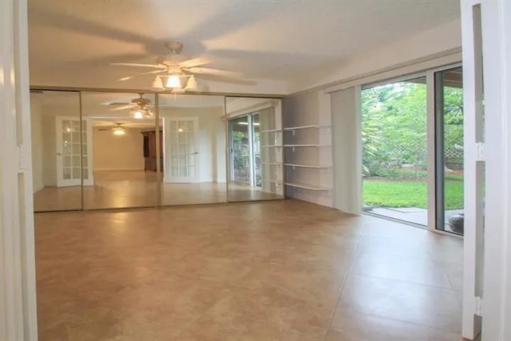Office/den or additional bedroom, huge room with French doors and direct access to the patio.