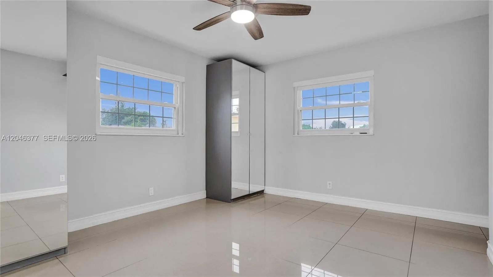 Primary with 2 mirrored closets and a deep closet virtually staged