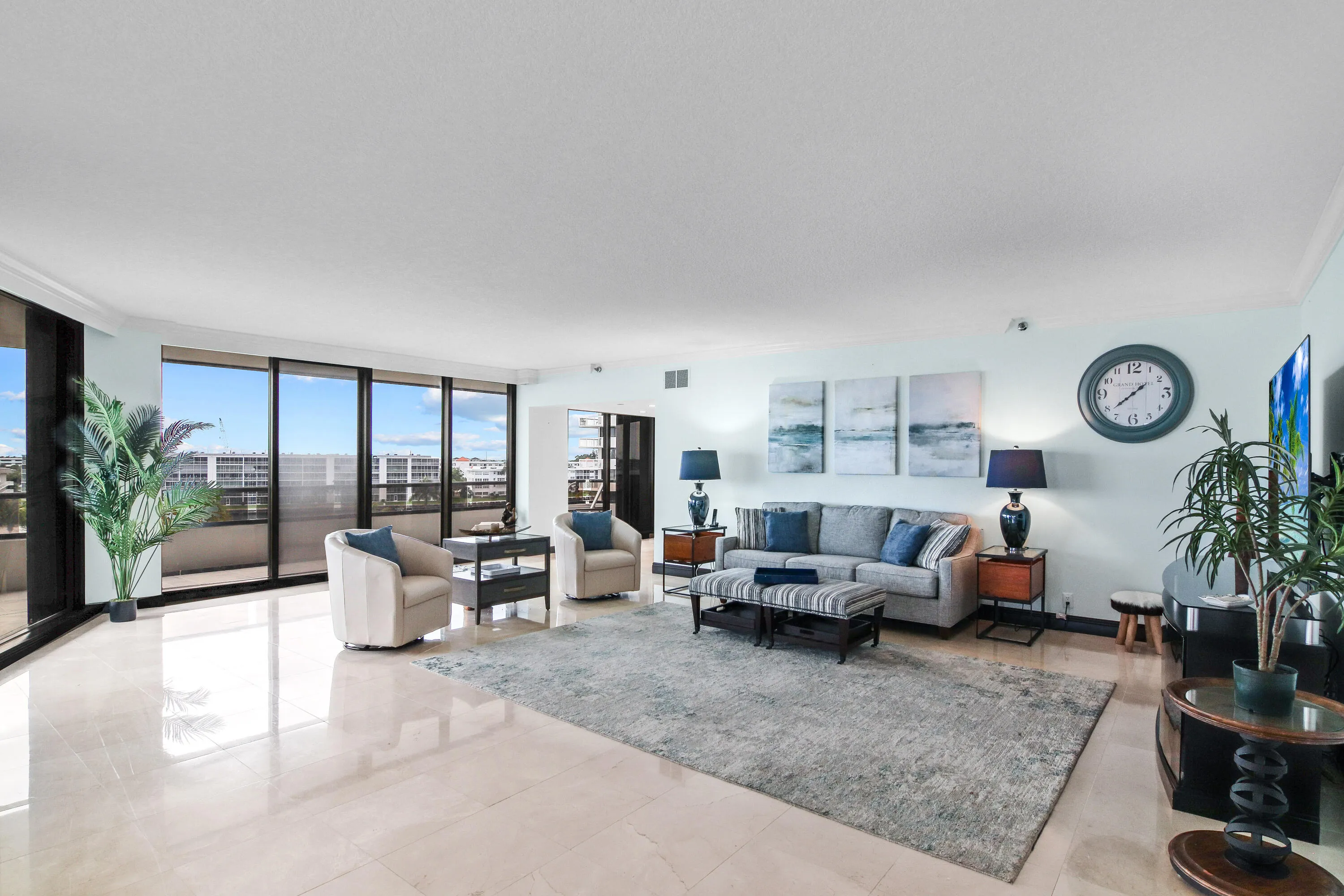 Living Room 1 - All sliders have electric shades.
