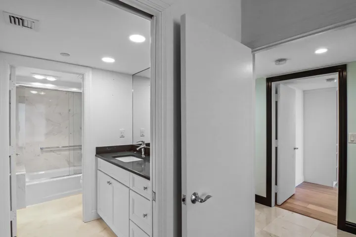 Ensuite to Guest Bedroom #1 (has tub/shower) and a walk-in closet (not shown)