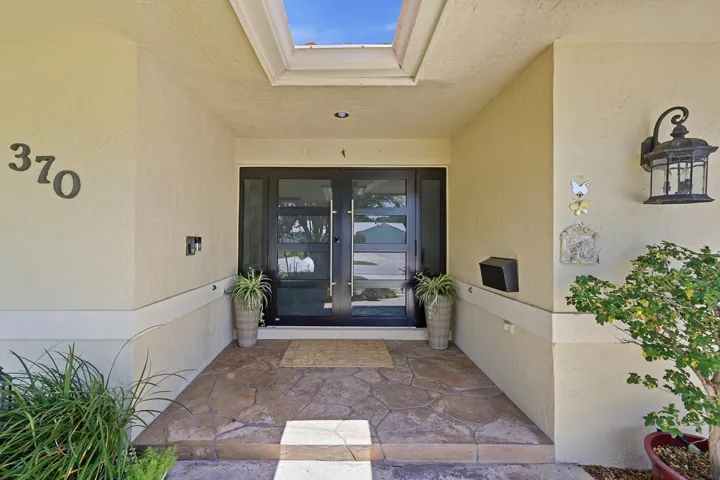 Exterior entry with two front door panels and side light windows. Impact resistant.