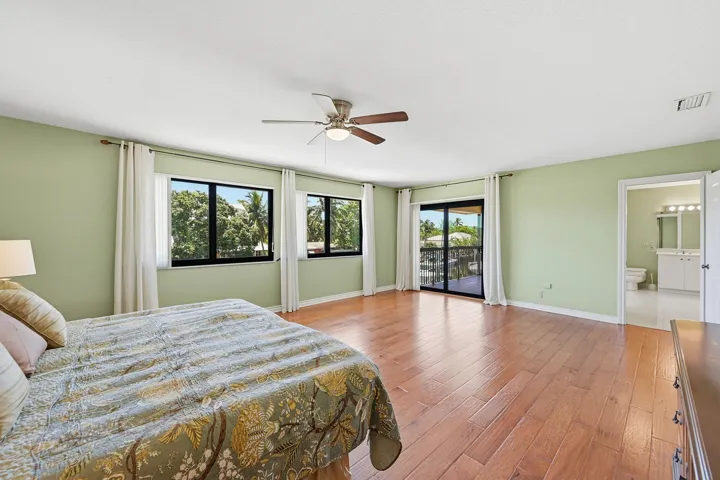 Expansive primary suite with balcony.