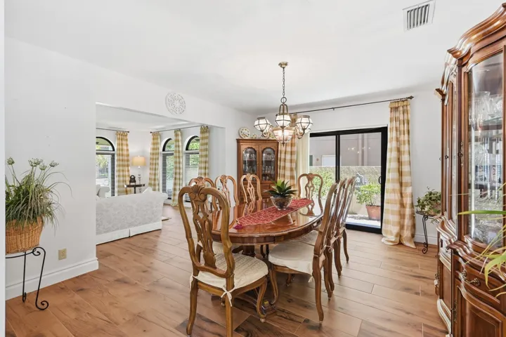 Spacious formal dining room with impact slider to side yard.