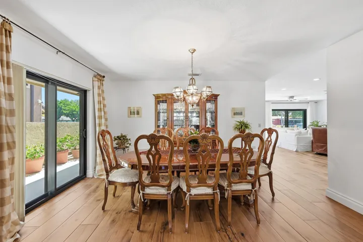 Spacious formal dining room with impact slider to side yard.