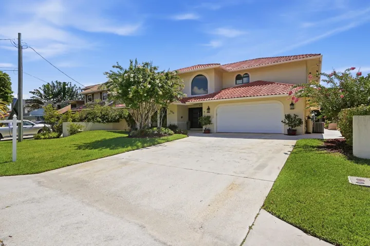 Spacious driveway and 2 car garage.
