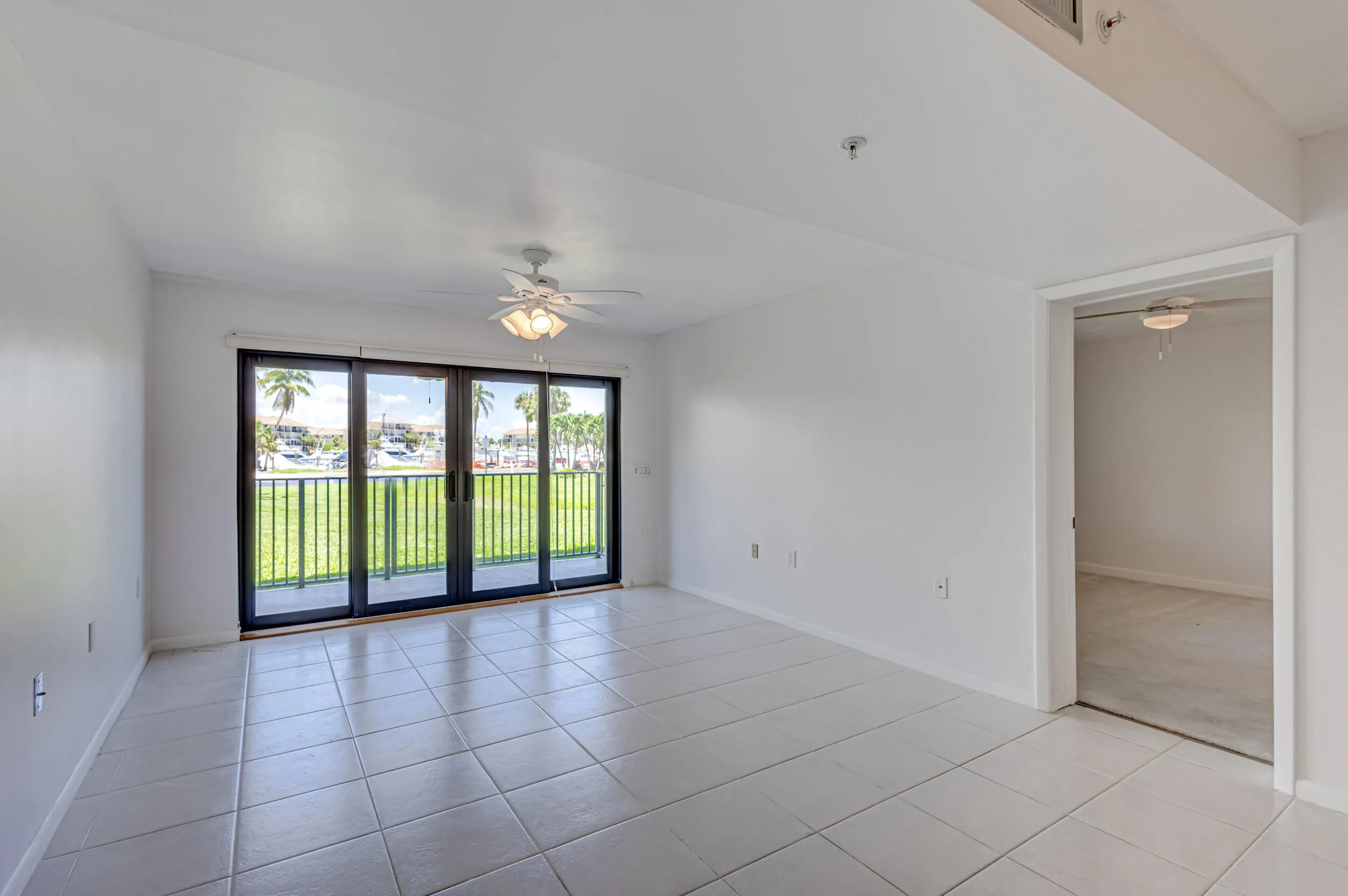 Hurricane impact sliders to covered dining alcove patio