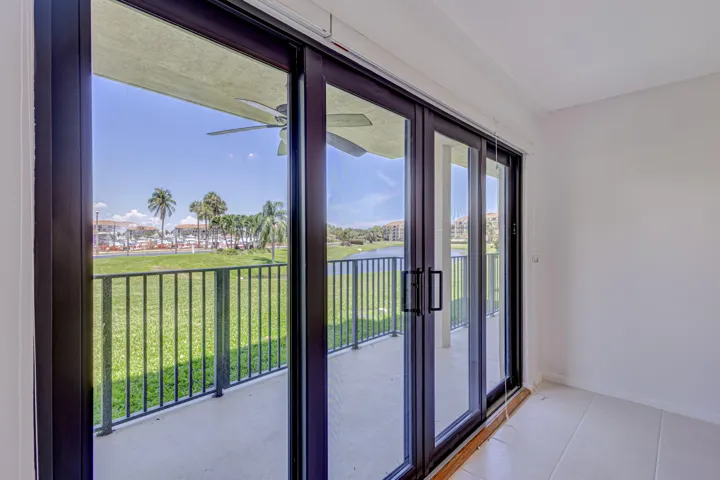 Hurricane impact sliders to covered dining alcove patio