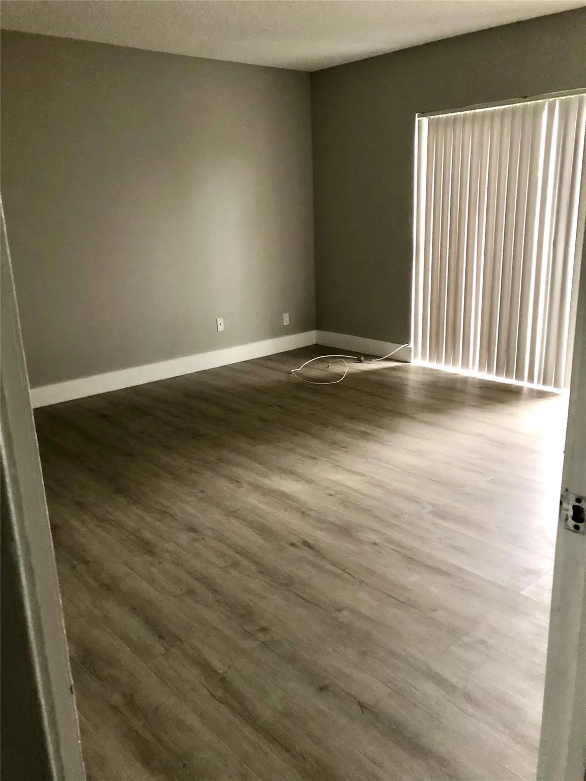 MASTER BEDROOM WITH PATIO SLIDER AND BALCONY