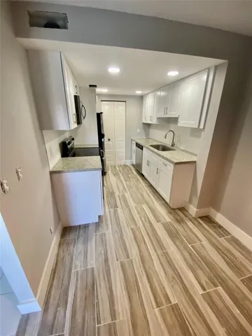 UPDATED KITCHEN AND WOOD LIKE TILE FLOORS