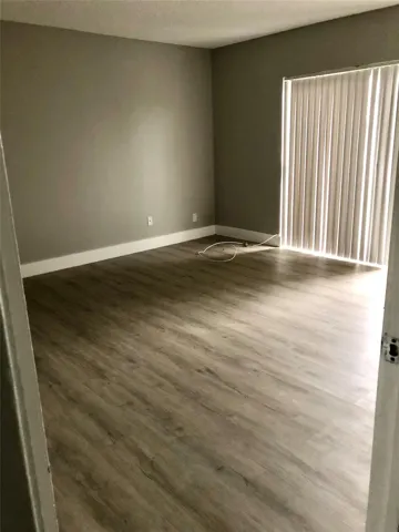MASTER BEDROOM WITH PATIO SLIDER AND BALCONY