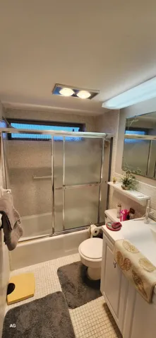 Bathroom with combo shower/tub