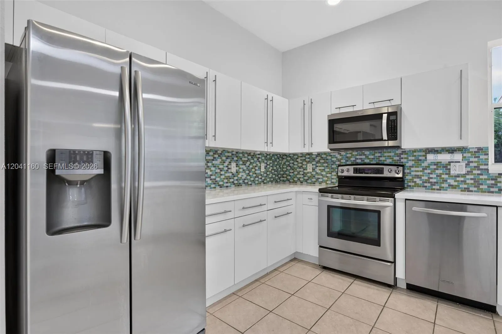 Modern Kitchen with SS appliances.