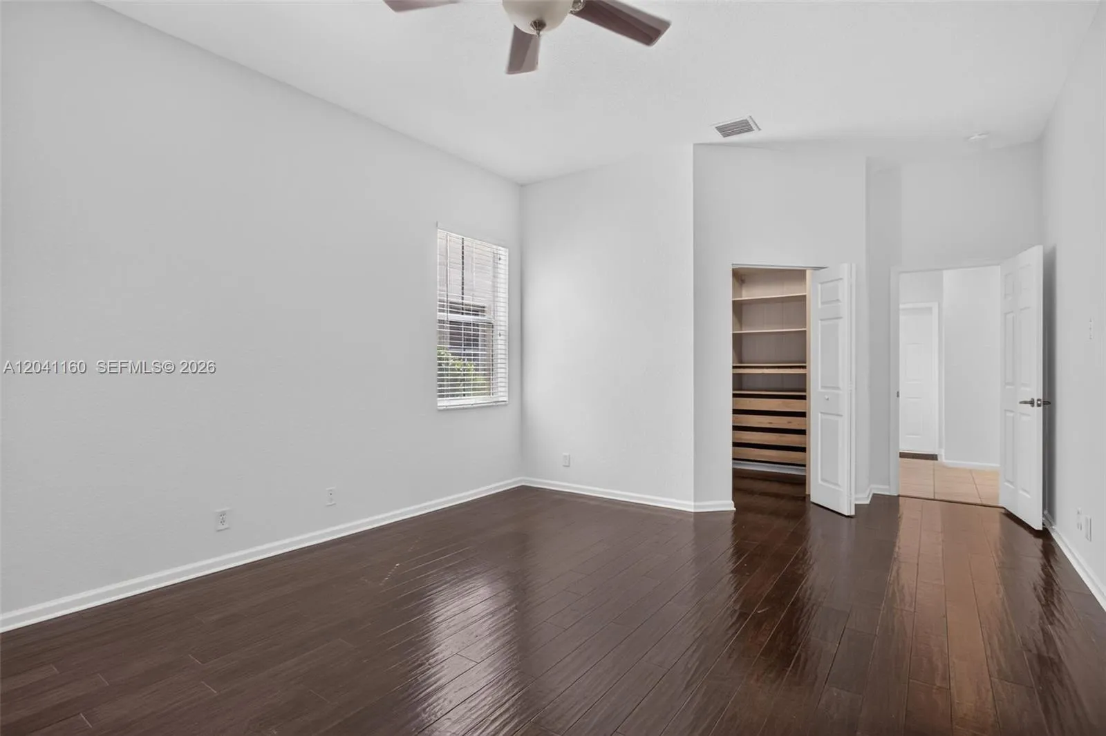 Large, primary bedroom with built-in, walk-in closet.