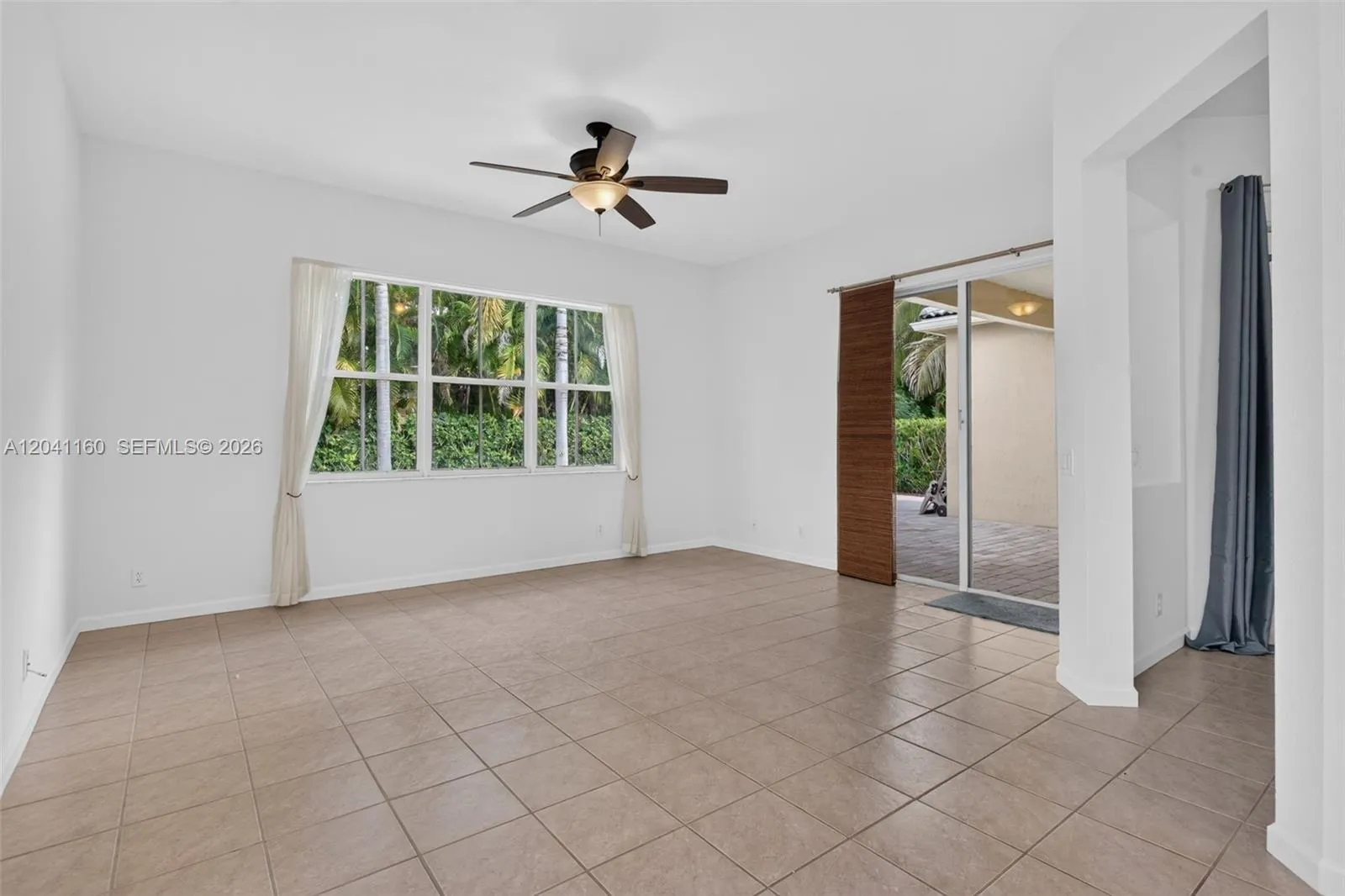 Family room with sliding doors to the patio and pool area.