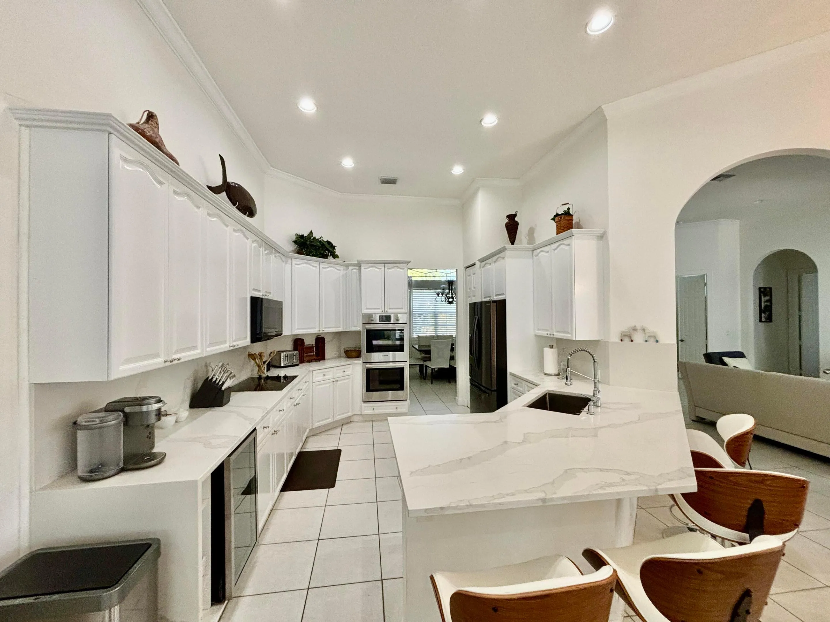 Open kitchen with all SS appliances